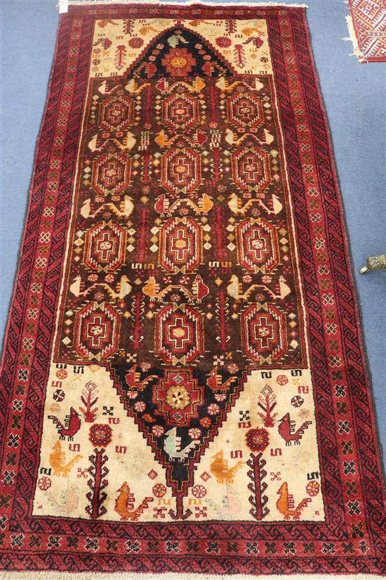 A Persian Kazak red ground rug, 200 x 100cm